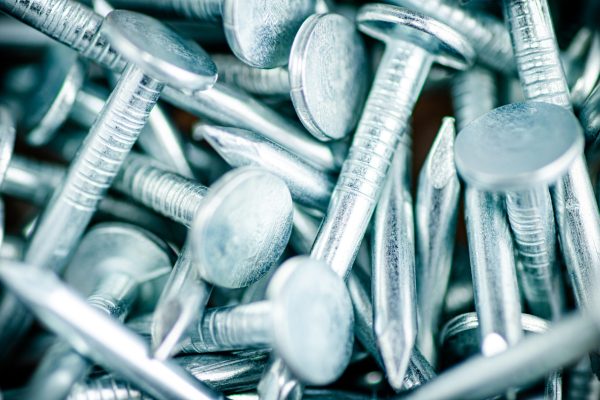 A pile of roofing nails. Macro background. High quality photo