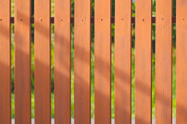 brown-artificial-wooden-fence-background-in-front-2023-11-27-05-07-23-utc