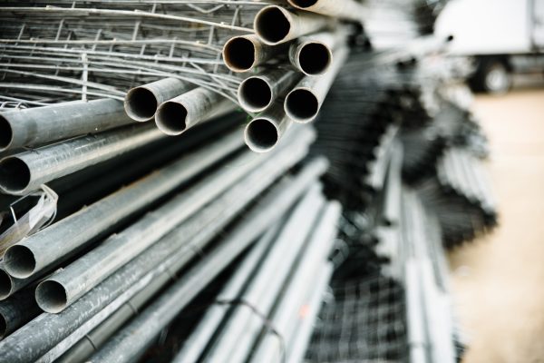 Portable steel barriers piled on the street.